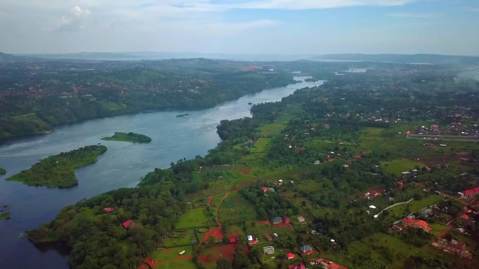 The Nile winding past green shores near Jinja, photographed from above